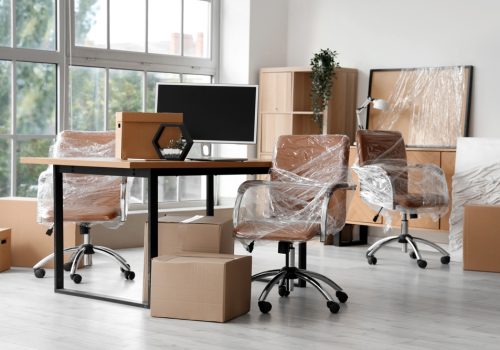 Interior,Of,Modern,Office,With,Chairs,Wrapped,In,Stretch,Film